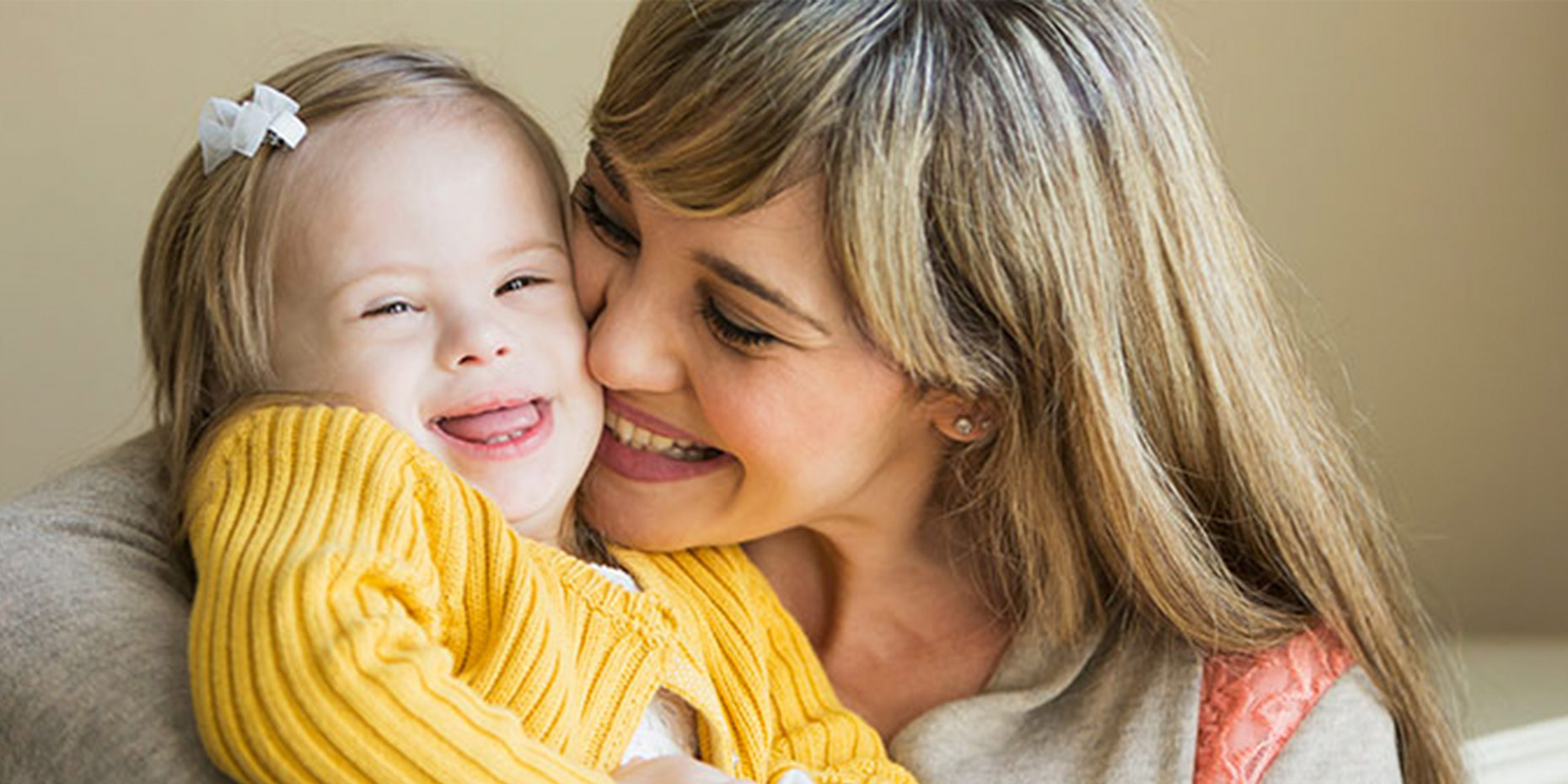 Woman holding child smiling laughing