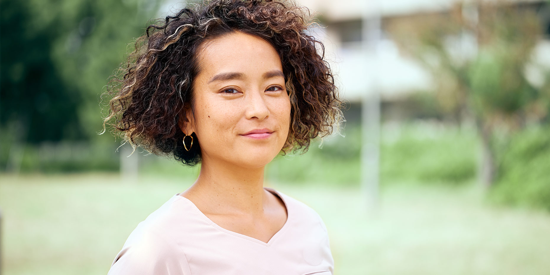 Woman looking into camera smiling