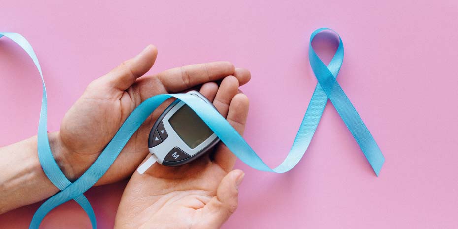 Generic Decorative Image showing glucose meter and diabetes awareness ribbon