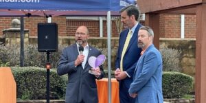 David Donohue, president of CareSource PASSE, presents a 2024 Heart of the Community Award to Ron Ekstrand, CEO of Easterseals Arkansas, and Brad Hagan, vice president of adult services at Easterseals Arkansas, for their recent work developing the Roommate Housing program. 