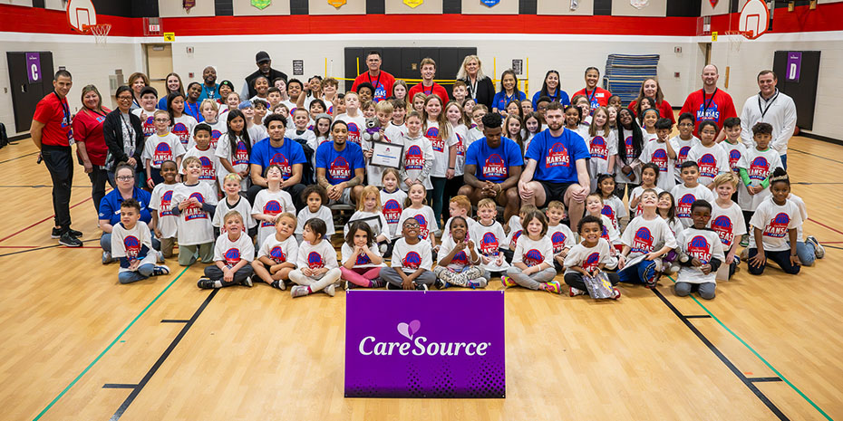 CareSource teamed up with basketball players from the University of Kansas to surprise children at the YMCA of Greater Kansas City's after school program at Nieman Elementary School.